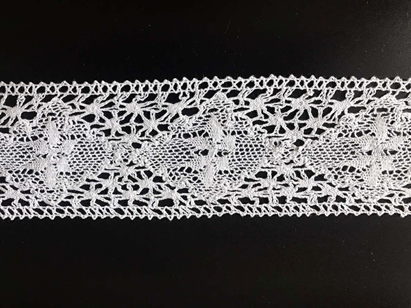 Cotton white lace; width 9 cm; 91.4 m per roll.
