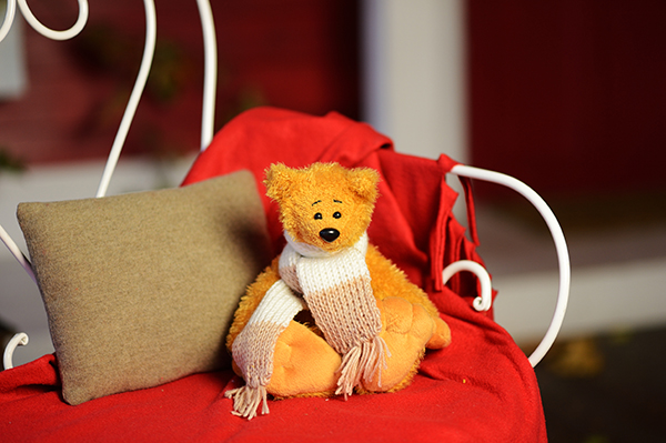 Teddy bear with a scarf 23 cm