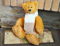 Teddy bear with a scarf 23 cm