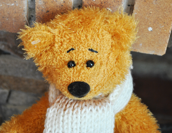 Teddy bear with a scarf 23 cm