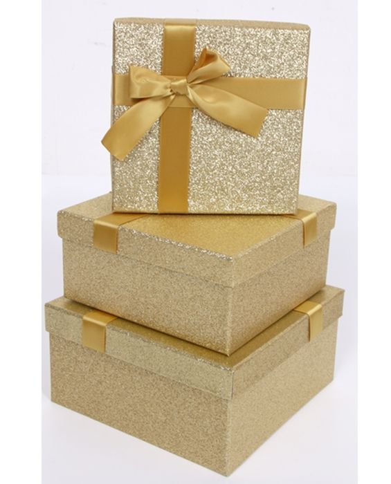 A set of 3 square gold gift boxes