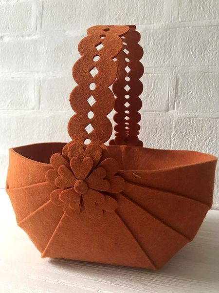 Decorative basket with an openwork handle
